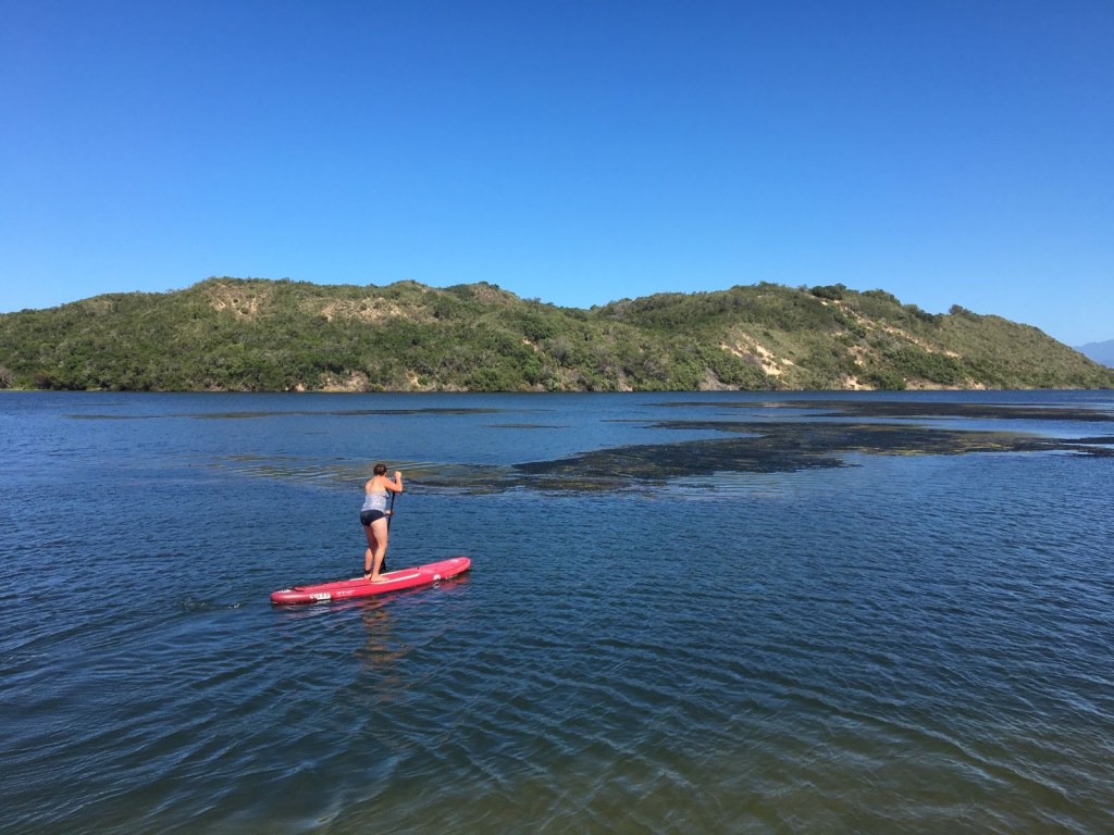 SUP boarding on the Swartvlei Lagoon in Sedgefield i the Garden Route