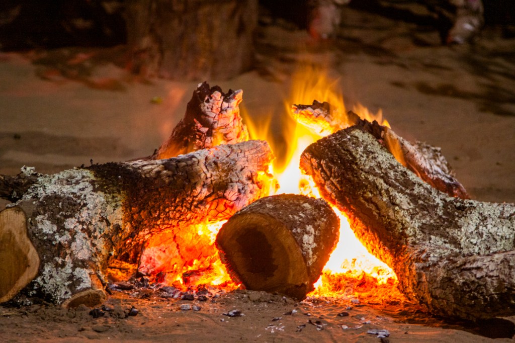 On Heritage Day friends and family gather round a fire for a braai