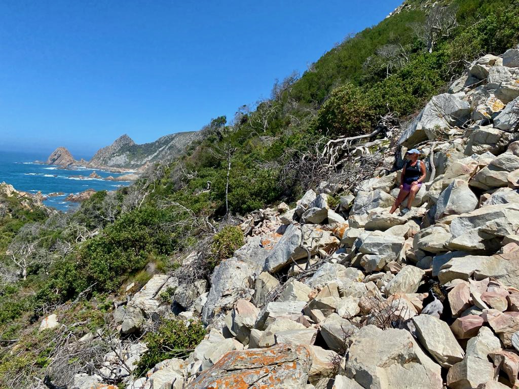 A challenging scramble over rocks on the Kranshoek Coastal Trail